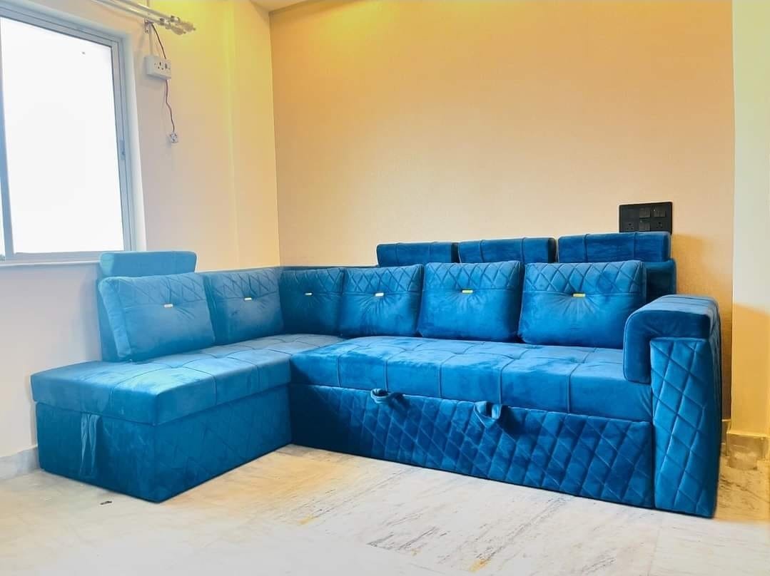 Peacock blue custom L-shape sofa installed in a bright modern Kolkata living room