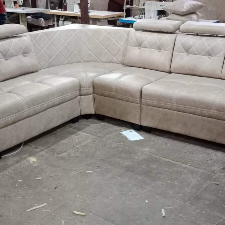 Custom cream beige corner sectional sofa with diamond quilted back and adjustable headrests