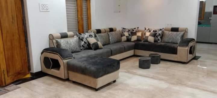Custom U-shaped modular sectional sofa in charcoal grey and beige with built-in armrest display niches