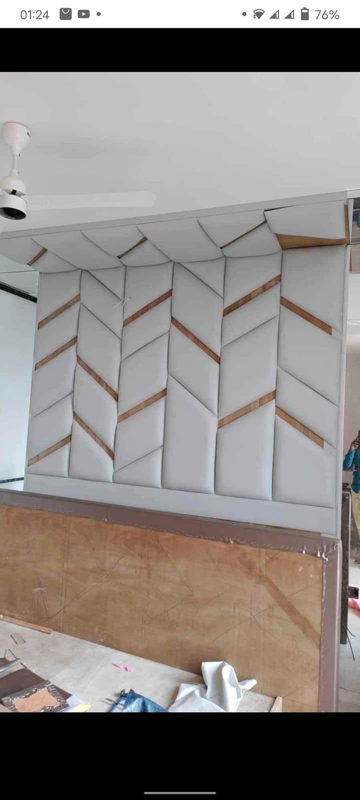 Custom architectural wall panelling with rich wood inlays and overhead cabinetry pelmet by Refurnix